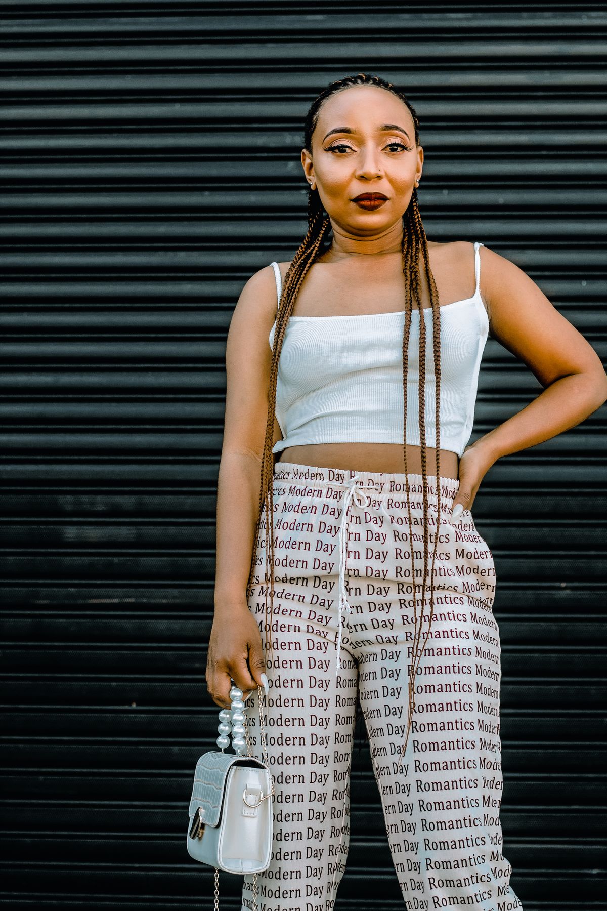 Printed trousers paired with a plain white top