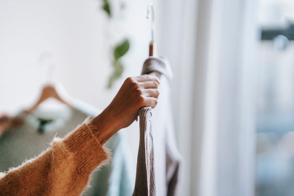A familiar garment being lifted from its hanger
