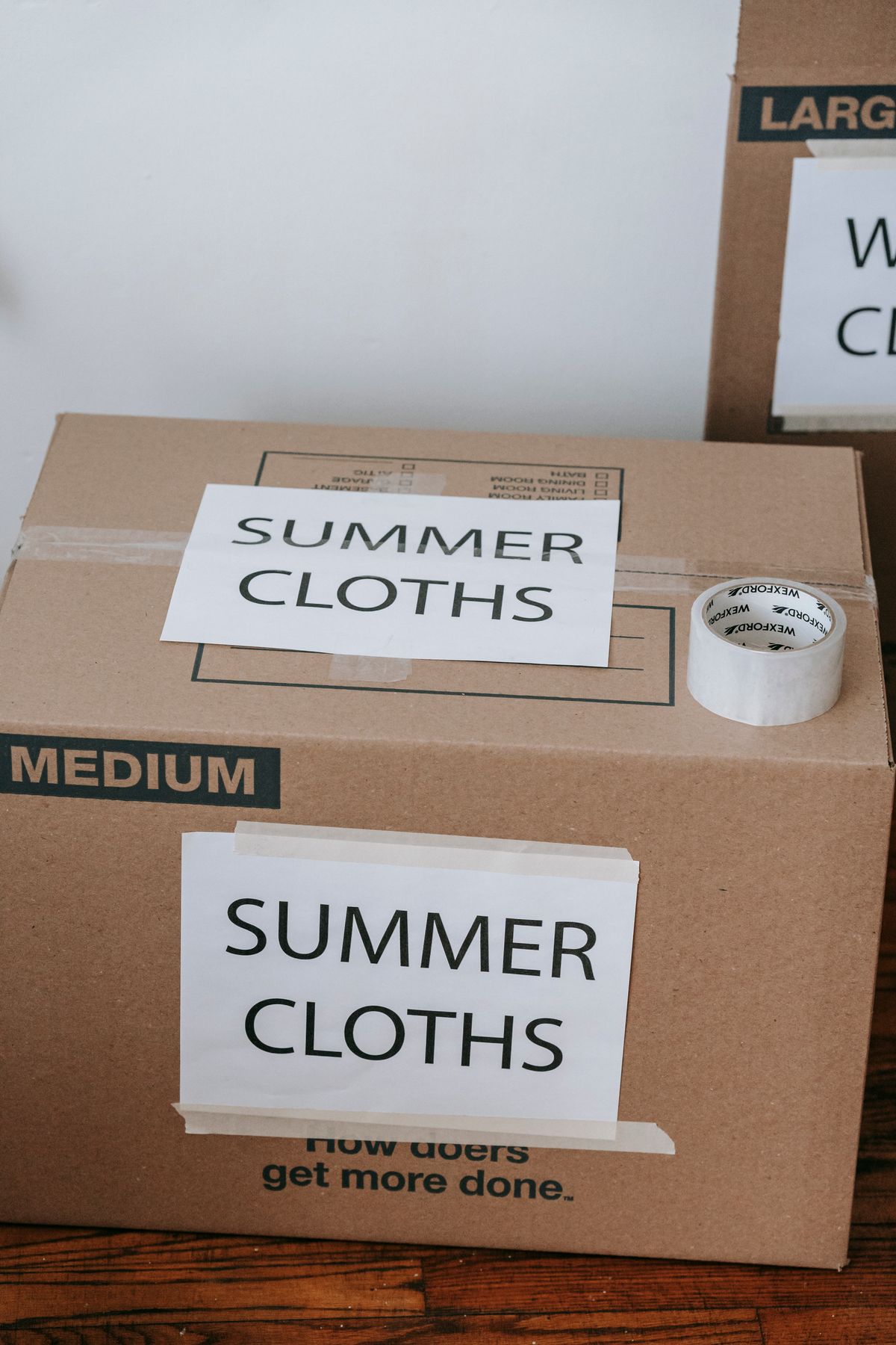 Labelled boxes set aside for seasonal clothing