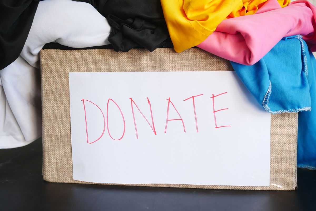 A box of clothing set aside for donation