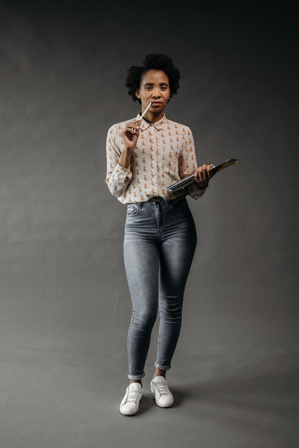 A patterned blouse and jeans used for a relaxed work outfit