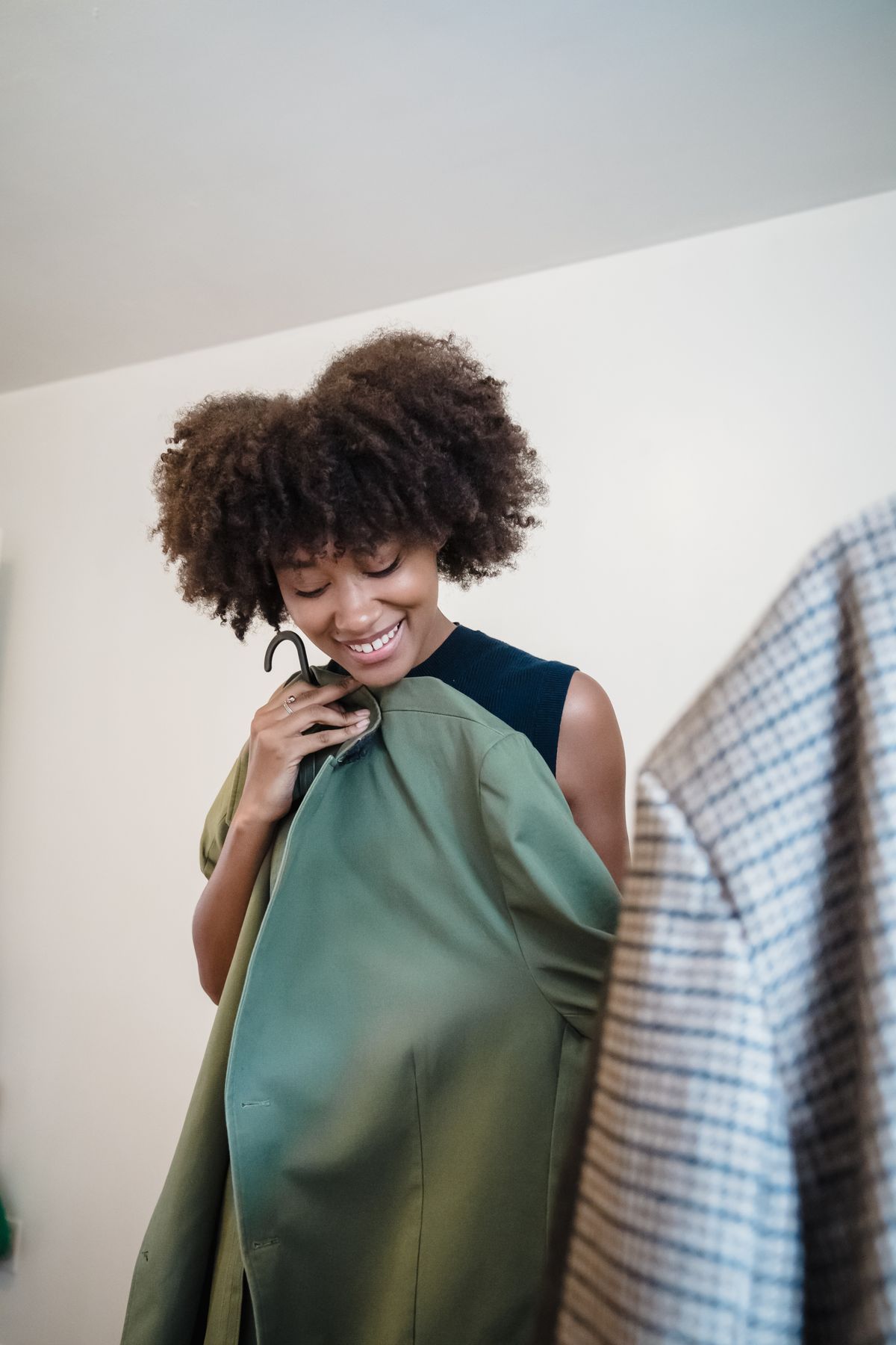 A woman taking another look at a garment on a hanger