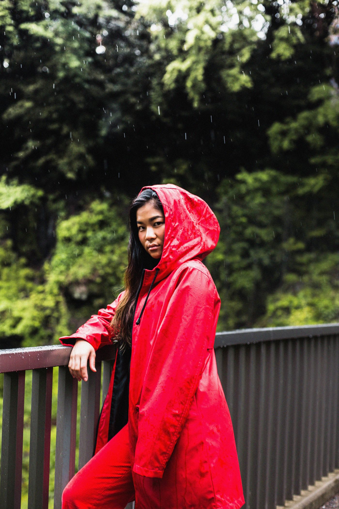 A red hooded raincoat worn outdoors
