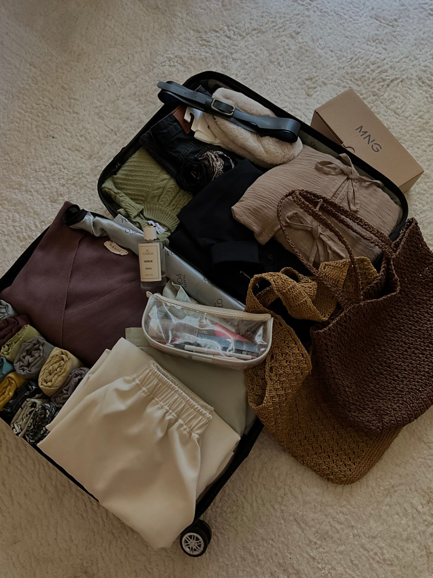 Clothes and accessories packed into compact luggage