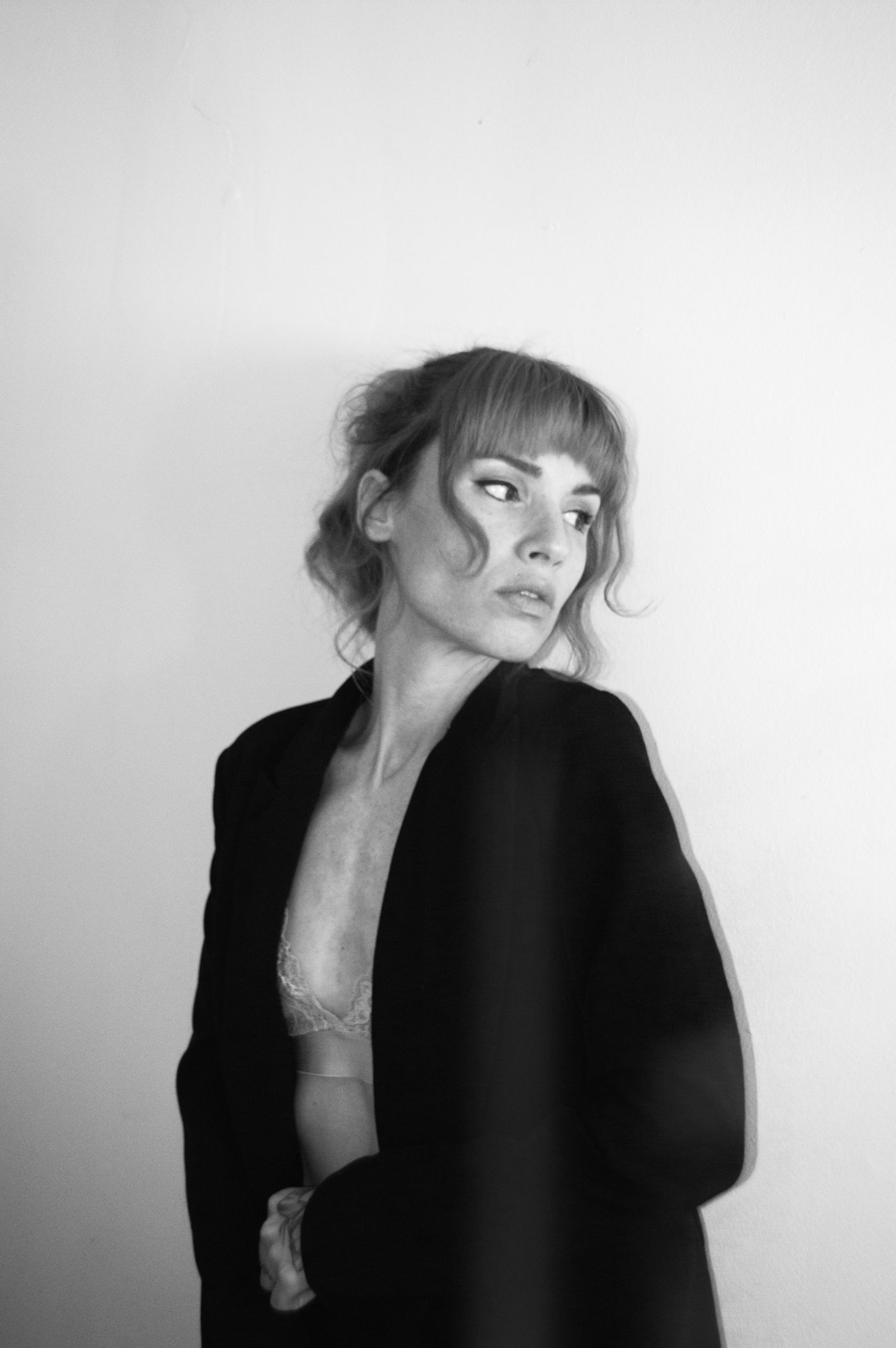 The shoulder and back of a dark blazer