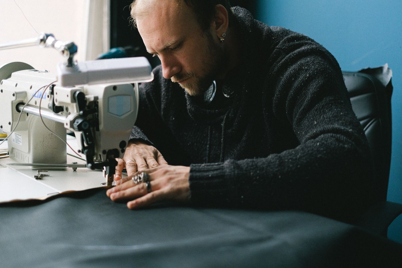A tailor working at a sewing machine