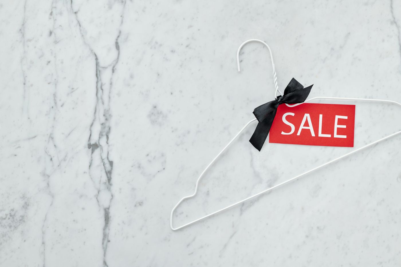 A sale tag attached to a clothes hanger